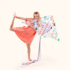 Girl playing with Happy Days kite